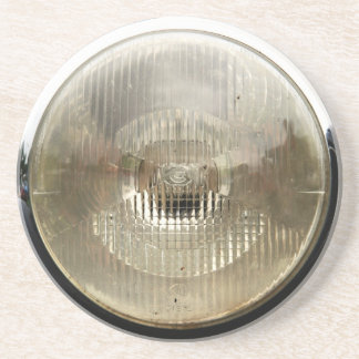Klassieke koplamp met ronde, heldere glazen lens zandsteen onderzetter