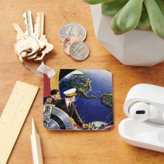 Klassieke sciencefictionastronauten in een baan om sleutelhanger (Bureau)