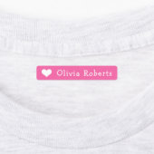 Kleding van tekstroze textiel met een paardehart labels (Aangebracht)