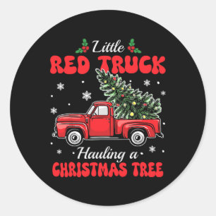 Kleine rode vrachtwagens vervoeren kerstboom par ronde sticker