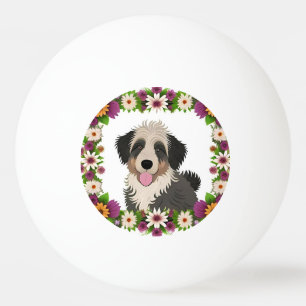 Kleurrijk bloemenkader met leuke hondenillustratie pingpongballen