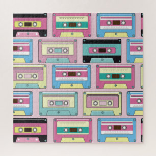 Kleurrijke cassettes, roze achtergrondpatroon. legpuzzel