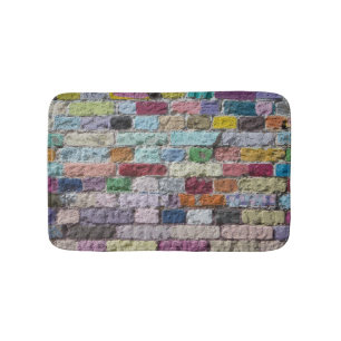Kleurrijke geschilderde bakstenen wandtextuur badmat