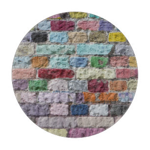 Kleurrijke geschilderde bakstenen wandtextuur snijplank