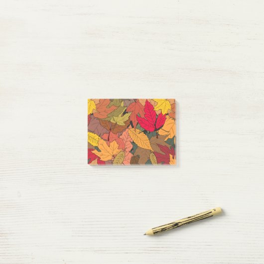 Kleurrijke herfstbladeren post-it® notes (Op bureau)