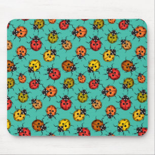 Kleurrijke lieveheersbeestjes op turquoise muismat