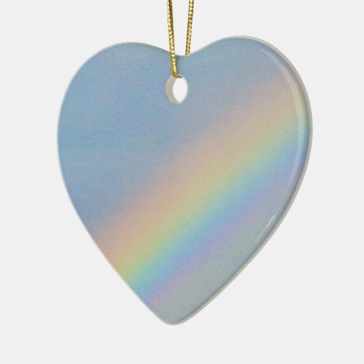 Kleurrijke regenboog in blauwe lucht, jonge vrouw keramisch ornament (Links)