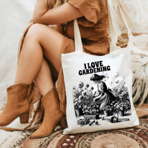 Knielen in een tuin tote bag