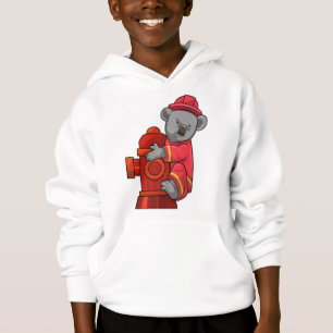 Koala als brandweerman met brandkraan