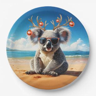 Koala op het strand met een gewei en kerstballen papieren bordje