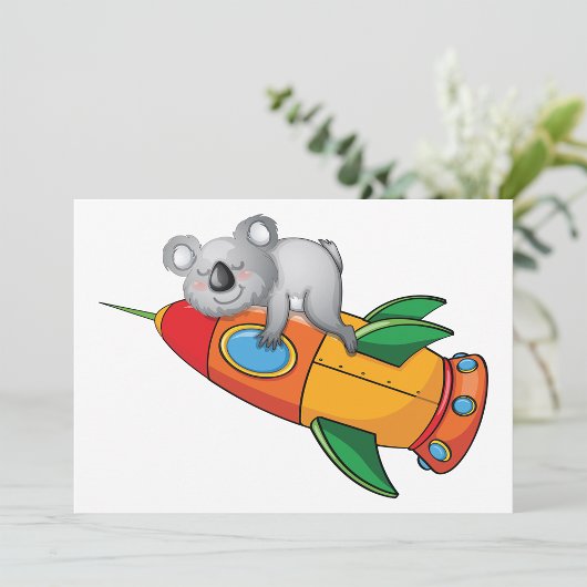 Koala slapen op kleurrijke raket kaart