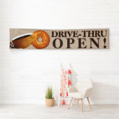 Koffie en bagel rijden door spandoek (Insitu)