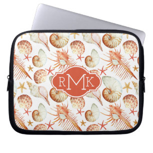 Koraal met een patroon voor schelpen en krabben laptop sleeve
