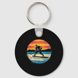 Kunst van ijshockeyspeler zonsondergang voor manne sleutelhanger