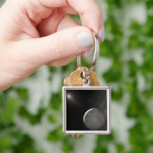 Kunstkunstenaarsconcept Kuiper Belt object Sleutelhanger (Hand)