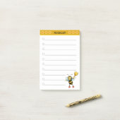 Kute honingbij op wit post-it® notes (Op bureau)