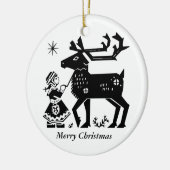 La fille de la Laponie tient la décoration de Noël (Gauche)