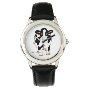 La montre de l'enfant noir et blanc de vache