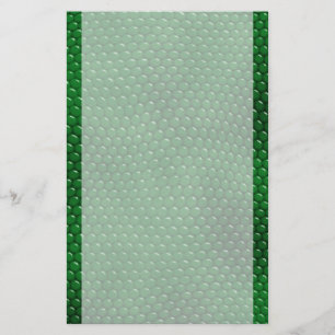 La peau vert clair de lézard mesure la papeterie