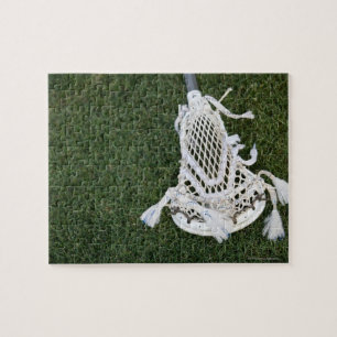 Lacrosse stokje op gras legpuzzel