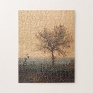 Landschap met een kale boom en een ploeger legpuzzel