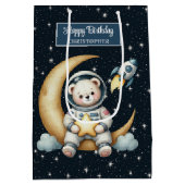 L'astronaute porte un sac cadeau pour la fête d'an (Dos)