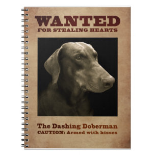 Le carnet se précipitant de dobermann