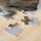 Le chat attaque le puzzle de teaser (Côté)