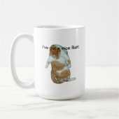 Le chat I ont une tasse intéressante de bout (Gauche)