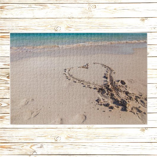 Le coeur dans le puzzle du sable