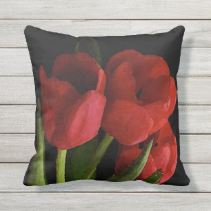 Le jardin rouge de tulipe fleurit le coussin