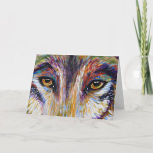 Le loup observe la carte de voeux