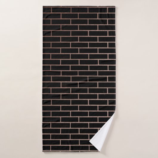Le mur en brique noire foncée a une surface rugueu (Serviette de bain)