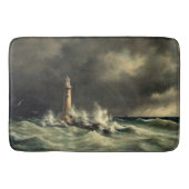 Le phare d'océan ondule le tapis de bain de roches (Devant)