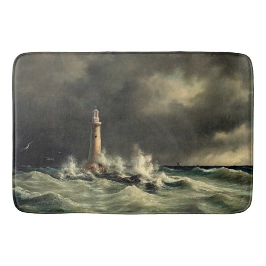 Le phare d'océan ondule le tapis de bain de roches (Devant)