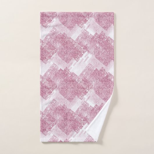 Le rose brille sur le blanc. (Serviette à main)