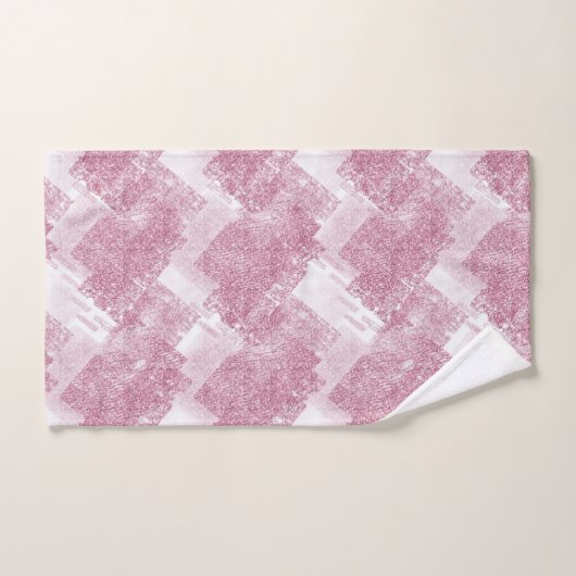Le rose brille sur le blanc. (Serviette à main)
