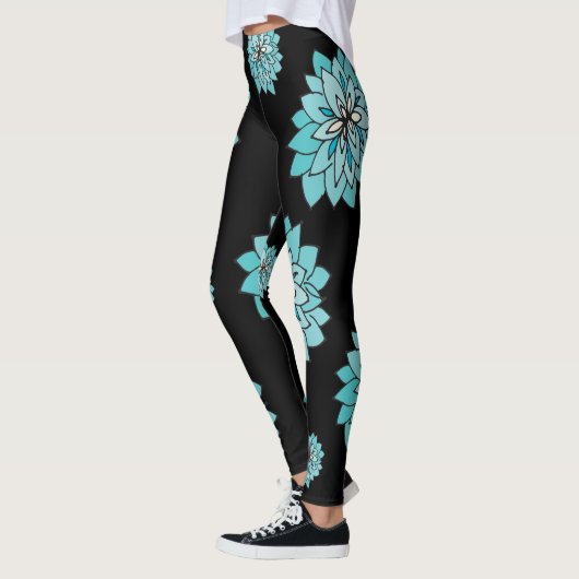 Legging noir avec la conception bleue turquoise (Gauche)