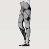 Leggings asymétriques gris et noirs par Joya Eve (Gauche)