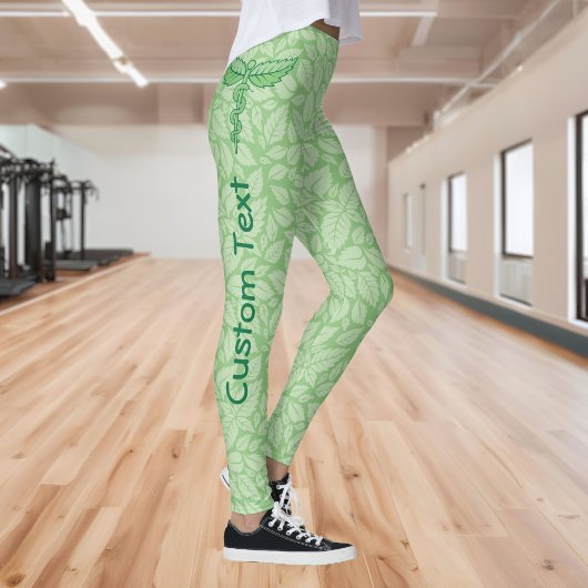 Leggings Caducée avec fond de feuilles