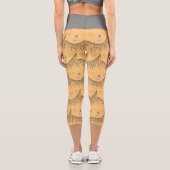 Leggings Capri Capris avec une fille sur la voile en or et noir (Verso)