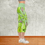 Leggings Capri Carton Mandala Flower vert et rose<br><div class="desc">Cette fleur de mandala funky design présente le vert et le rose dans un style de dessin animé. Des visuels géométriques trippy pour l'hippie moderne ou amoureux de couleurs vibrantes!</div>