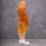 Leggings Capri Dessin Mandala Fleur orange et rouge<br><div class="desc">Cette fleur de mandala funky est orangée et rouge dans un style de dessin animé. Des visuels géométriques trippy pour l'hippie moderne ou amoureux de couleurs vibrantes!</div>