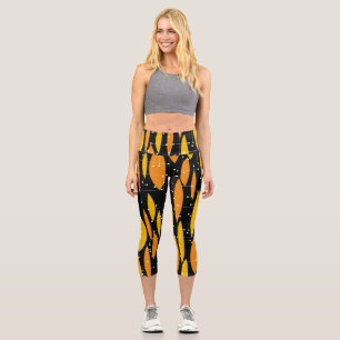 Leggings Capri Style atomique, motif géométrique noir orange.