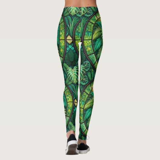 Leggings featuring a vibrant green tropical leaf  (Dos)