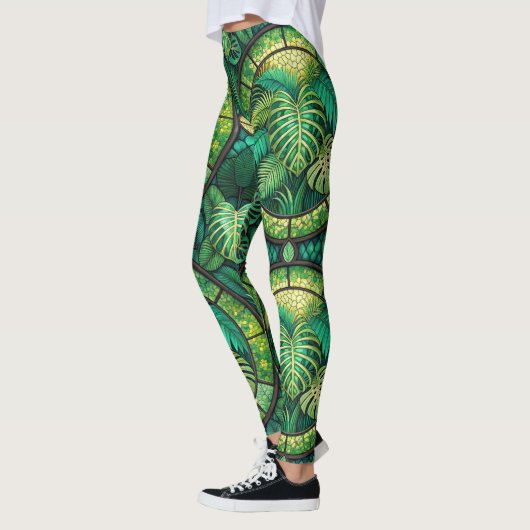Leggings featuring a vibrant green tropical leaf  (Gauche)