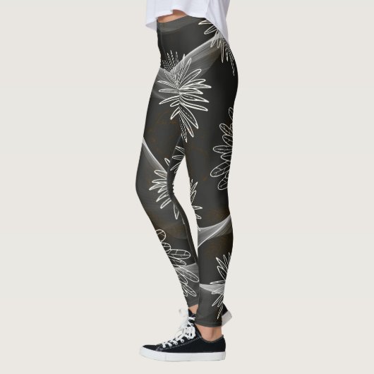 Leggings foncés avec de grandes fleurs blanches et (Gauche)