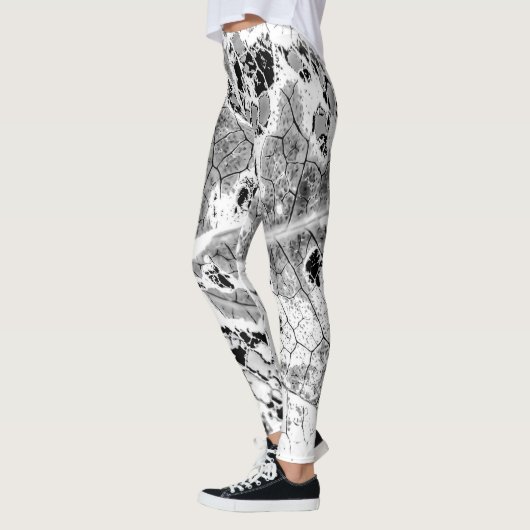 Leggings Guêtres noires et blanches d'impression de feuille (Gauche)