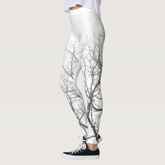 Leggings Légendes blanches avec branches d'arbres. (Gauche)