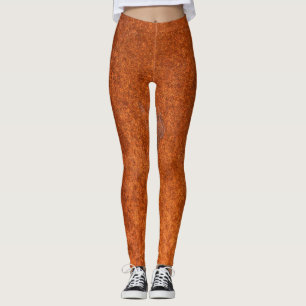 Leggings métal rouillé patiné : texture orange-rouge.